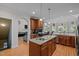 Gourmet kitchen featuring granite countertops, stainless steel appliances, and a kitchen island at 109 San Juan Dr, Chapel Hill, NC 27514