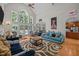 Spacious living room with high ceilings, large windows, and stylish decor with views of the yard at 109 San Juan Dr, Chapel Hill, NC 27514