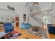 Open-concept living room with high ceilings, hardwood floors, staircase, and stylish decor at 109 San Juan Dr, Chapel Hill, NC 27514
