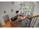 Living room showcasing hardwood floors, a fireplace, and large windows offering natural light at 109 San Juan Dr, Chapel Hill, NC 27514