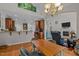 Open concept dining area showing kitchen with bar top and living room beyond at 109 San Juan Dr, Chapel Hill, NC 27514