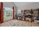 Spacious home office featuring built-in bookshelves and a large picture window at 109 San Juan Dr, Chapel Hill, NC 27514