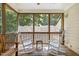 Screened porch with rocking chairs and wooded views at 109 San Juan Dr, Chapel Hill, NC 27514