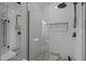 Modern walk-in shower featuring glass enclosure and decorative tile at 109 San Juan Dr, Chapel Hill, NC 27514