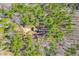 Aerial view of a cozy cabin nestled among dense trees, creating a private, secluded retreat at 1101 Dimmocks Mill Rd, Hillsborough, NC 27278