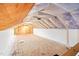 Unfinished attic with plywood flooring and insulation, offering potential for future expansion at 1101 Dimmocks Mill Rd, Hillsborough, NC 27278