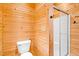 Bathroom featuring a toilet and stand-up shower with glass doors at 1101 Dimmocks Mill Rd, Hillsborough, NC 27278