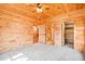 Wooden bedroom with ceiling fan, ensuite bath and walk-in closet at 1101 Dimmocks Mill Rd, Hillsborough, NC 27278