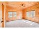 Wooden bedroom with neutral carpet and views of surrounding trees at 1101 Dimmocks Mill Rd, Hillsborough, NC 27278