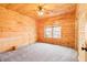 Bedroom featuring light colored, continuous wooden paneling at 1101 Dimmocks Mill Rd, Hillsborough, NC 27278