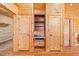 Built-in shelving and desk area with wooden cabinets and granite countertop at 1101 Dimmocks Mill Rd, Hillsborough, NC 27278