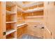 Walk-in closet with white shelving, perfect for organized storage at 1101 Dimmocks Mill Rd, Hillsborough, NC 27278