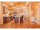 Spacious, wooden kitchen with stainless steel appliances and breakfast bar at 1101 Dimmocks Mill Rd, Hillsborough, NC 27278