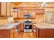 Kitchen showcasing stainless appliances, granite countertops, and an eat-in bar at 1101 Dimmocks Mill Rd, Hillsborough, NC 27278