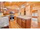 Open kitchen with stainless appliances, granite countertops, and wooden cabinets at 1101 Dimmocks Mill Rd, Hillsborough, NC 27278