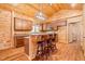 Kitchen with an island with bar seating, wooden cabinets, and stainless steel appliances at 1101 Dimmocks Mill Rd, Hillsborough, NC 27278