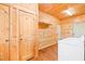 Natural wood laundry room with washer and dryer hookups and ample storage space at 1101 Dimmocks Mill Rd, Hillsborough, NC 27278