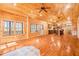 Spacious living room with hardwood floors, a fireplace, and a view of the kitchen at 1101 Dimmocks Mill Rd, Hillsborough, NC 27278