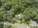 Aerial view of a home nestled among lush greenery and mature trees at 111 Canberra Ct, Cary, NC 27513