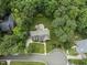 A lush, green canopy surrounds this home, enhanced by a fire pit and meticulous lawn care at 111 Canberra Ct, Cary, NC 27513