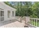 Expansive wooden back deck offering a serene outdoor space with views of the surrounding wooded landscape at 111 Canberra Ct, Cary, NC 27513