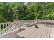 Inviting back deck with bench seating, surrounded by lush greenery and ample space for outdoor enjoyment at 111 Canberra Ct, Cary, NC 27513