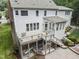 Aerial view showcases a deck with stairs leading to a unique brick patio at 111 Canberra Ct, Cary, NC 27513