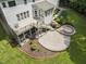 The expansive backyard features a multi-level deck and custom brick patio for outdoor entertaining at 111 Canberra Ct, Cary, NC 27513