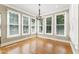 Inviting dining room filled with natural light from the surrounding windows at 111 Canberra Ct, Cary, NC 27513