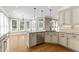 Bright kitchen featuring granite countertops, stainless steel appliances, and ample storage at 111 Canberra Ct, Cary, NC 27513
