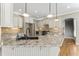 Elegant kitchen with granite countertops, custom cabinets, and stainless steel appliances at 111 Canberra Ct, Cary, NC 27513