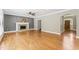 Hardwood floors shine in the cozy living room with a fireplace and abundant natural light at 111 Canberra Ct, Cary, NC 27513