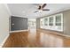 Bright living room featuring hardwood floors, large windows, and neutral paint at 111 Canberra Ct, Cary, NC 27513