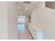 Bright hallway featuring wood floors, recessed lighting, and a white cabinet with countertop at 1194 Alston Landing Way # 04, Cary, NC 27519
