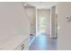Hallway featuring wood floors, recessed lighting, a cabinet with countertop, and access to the back porch at 1194 Alston Landing Way # 04, Cary, NC 27519