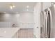 A modern kitchen with a large island, stainless steel appliances, and white cabinets at 1194 Alston Landing Way # 04, Cary, NC 27519