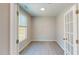 Bright home office with a window, white trim, and a glass-paneled door at 1194 Alston Landing Way # 04, Cary, NC 27519