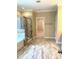 Bathroom featuring a tub and shower combo with decorative tile and gray tile floors at 1205 Capstone Dr, Durham, NC 27713
