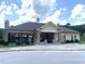 Attractive community clubhouse with stone pillars, a covered area, and adjacent parking at 1205 Capstone Dr, Durham, NC 27713
