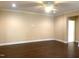Spacious living room boasts beautiful dark hardwood floors, neutral paint, and elegant trim at 1205 Capstone Dr, Durham, NC 27713