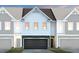 Charming townhome showcasing a contemporary design and inviting two-car garage at 1219 Everton Ave, Durham, NC 27703