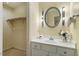 A well-lit bathroom features a white vanity, framed mirror, and ample storage space at 1317 Swallow Dr, Raleigh, NC 27606
