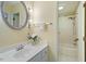 Bright bathroom featuring a framed mirror, a white vanity, and a shower-tub combo at 1317 Swallow Dr, Raleigh, NC 27606