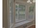 Bright bay window with a window seat looking out onto the landscaped yard at 133 Rustic Ln, Smithfield, NC 27577