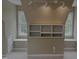 Sloped ceiling bedroom with a built-in shelf and two windows, offering lots of natural light at 133 Rustic Ln, Smithfield, NC 27577