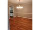 Inviting dining room with hardwood floors and an elegant chandelier at 133 Rustic Ln, Smithfield, NC 27577