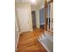 Entryway with hardwood floors and staircase leads to a view of the living room at 133 Rustic Ln, Smithfield, NC 27577