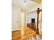 Spacious entryway with hardwood floors, staircase, and a view of the living room at 133 Rustic Ln, Smithfield, NC 27577