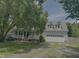 Charming two-story home with a welcoming front porch and attached two-car garage at 133 Rustic Ln, Smithfield, NC 27577