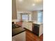 Modern kitchen island with a sink, stainless steel appliances, and granite countertops at 133 Rustic Ln, Smithfield, NC 27577